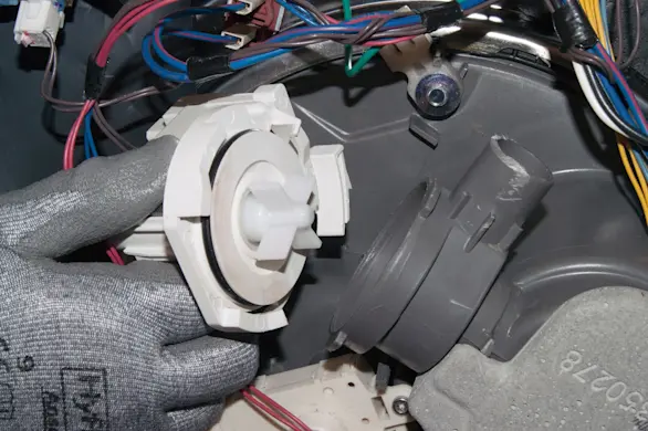 PHOTO: Install the new drain pump.