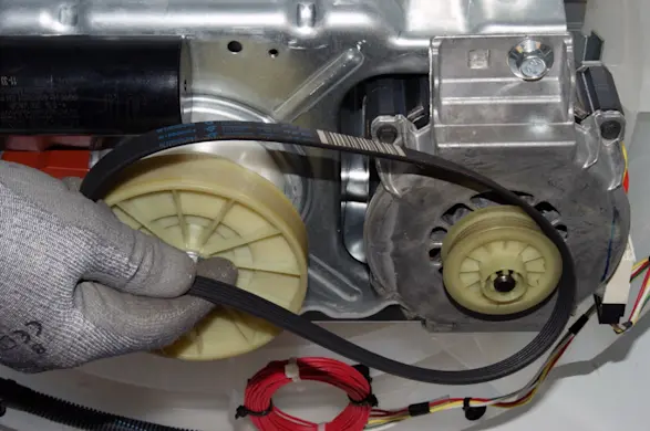 PHOTO: Remove the drive belt.