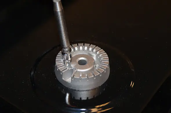 PHOTO: Remove the screw from the burner head.