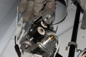 PHOTO: Pull the mounting bracket off the top of the valve coils.