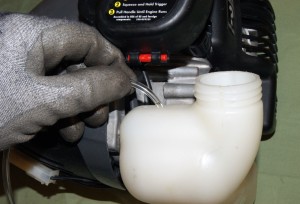 PHOTO: Feed the new fuel lines into the tank.