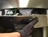 How to disassemble the ice and water dispenser on a GE refrigerator
