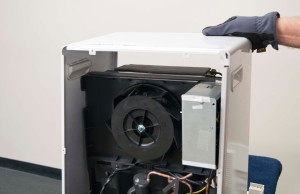 PHOTO: Remove the outer case from the dehumidifier.