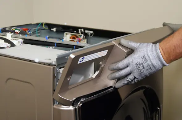 PHOTO: Pull the control panel off the washer.