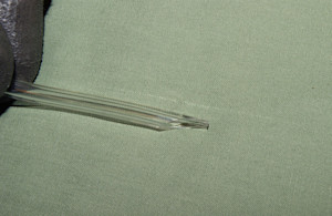 Fuel line cut at an angle.