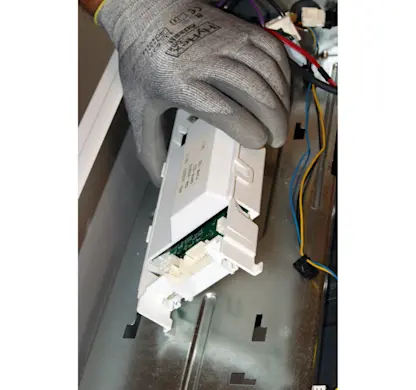 PHOTO: Remove the control board from the support bracket.
