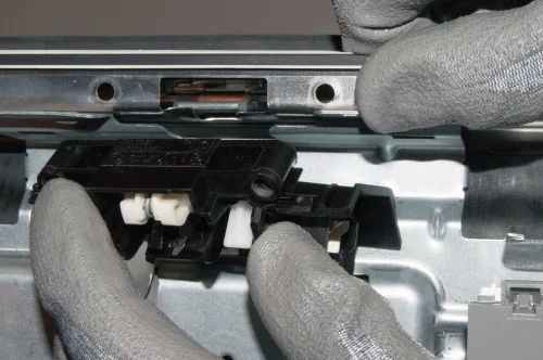 PHOTO: Install the new door latch assembly.