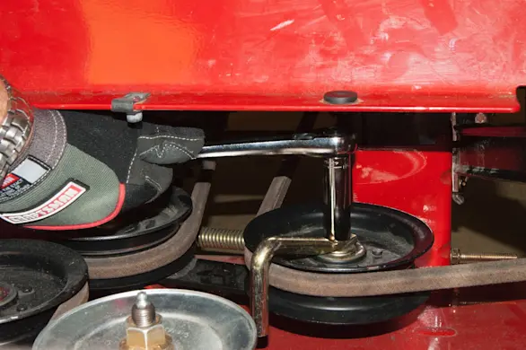 PHOTO: Loosen the belt guide nut.