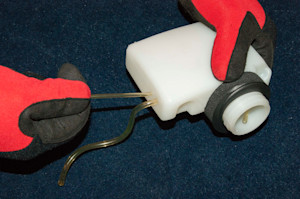 Pull the small fuel line out of the tank.