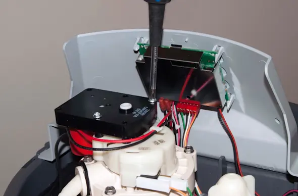 PHOTO: Remove the valve motor screws.