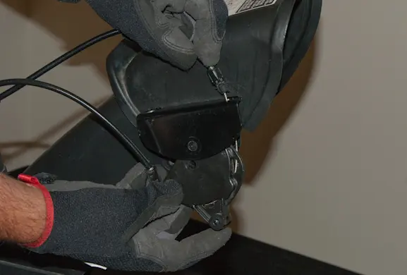 PHOTO: Connect the cables to the bracket.