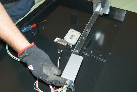 PHOTO: Remove the gear motor.
