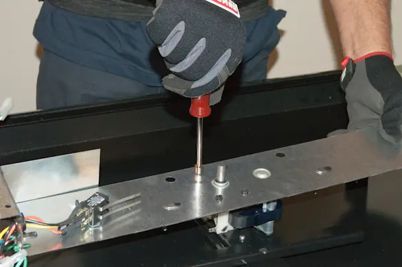 PHOTO: Attach the new gear motor to the bracket.
