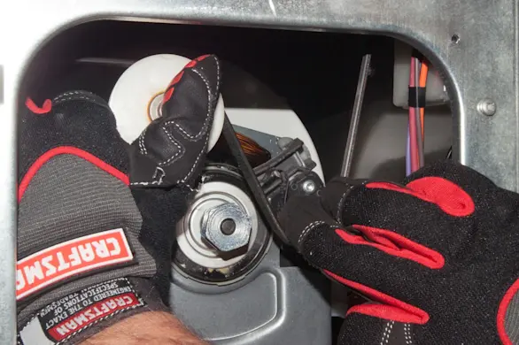 PHOTO: Release the dryer belt from the motor pulley.