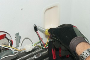 PHOTO: Remove the thermistor mounting screw.