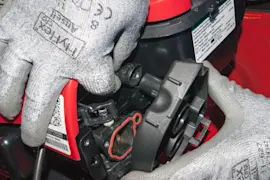 What causes lawn mower engine surging?