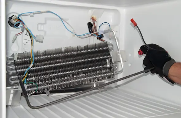 PHOTO: Remove the defrost heater.