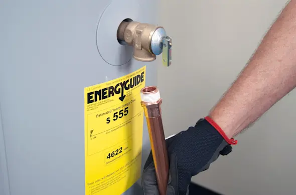 PHOTO: Install the drain pipe.