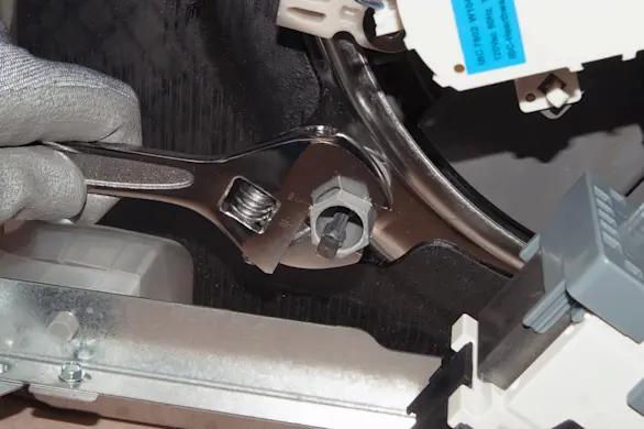 PHOTO: Remove the dishwasher heating element nuts.