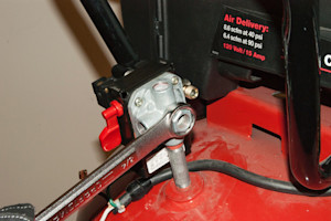 Screw on the new pressure switch.