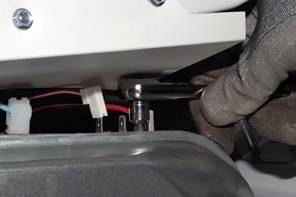 PHOTO: Remove the thermistor mounting screws.