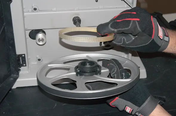 PHOTO: Install the new drive belt.