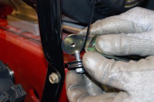 PHOTO: Remove the bolt from the cable guide pulley.