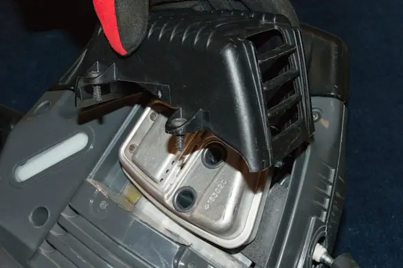 PHOTO: Remove the muffler guard cover.