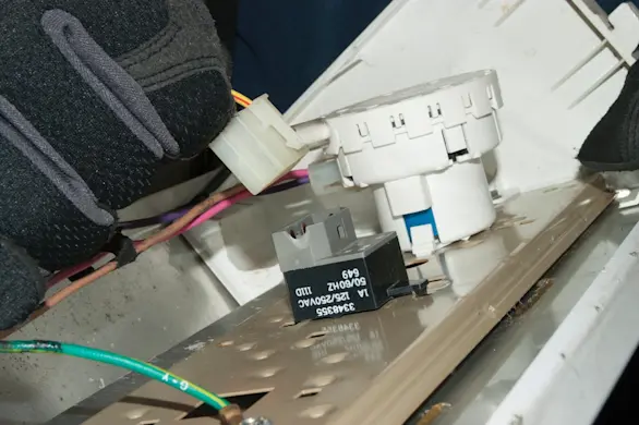 PHOTO: Disconnect the wire harness from the water temperature switch.