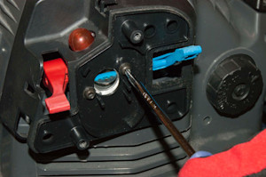 Reinstall the carburetor mounting screws.