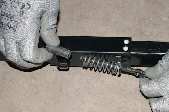 PHOTO: Reinstall the spring nut.