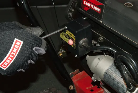 PHOTO: Remove the starter switch screws.