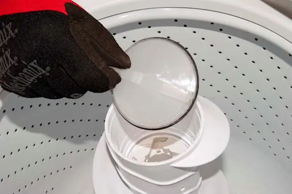 PHOTO: Remove the agitator dust cap.