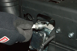 Remove the spark plug.