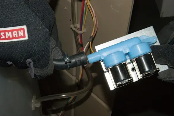 PHOTO: Connect the interior fill hose.