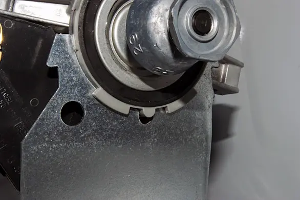PHOTO: Engage the motor locator tab with the mounting bracket slot.