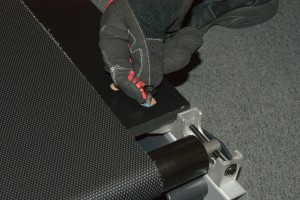 PHOTO: Reinstall the corner mounting screws.