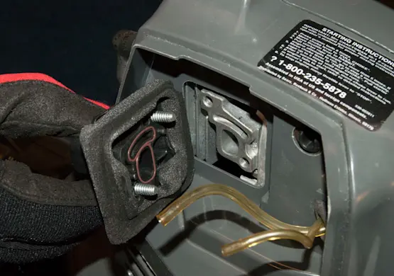 PHOTO: Remove the carburetor adapter and air dam.