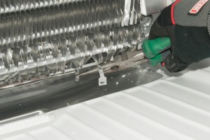 PHOTO: Unbuckle the defrost heater straps.
