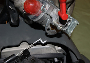 Disconnect the throttle control cable.