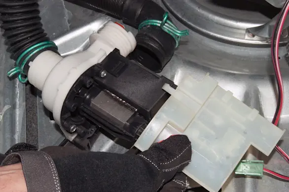 PHOTO: Reinstall the drain pump shield.