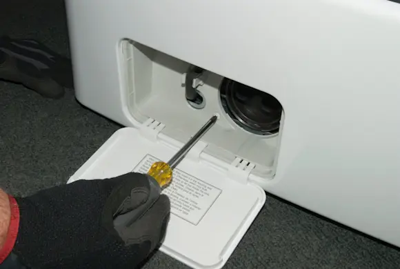 PHOTO: Remove the pump housing screws.