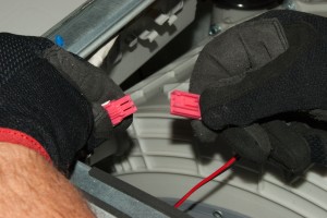 PHOTO: Unplug the washer drum light wire harness.