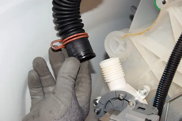 PHOTO: Pull the drain hose off the drain pump.
Pull the drain hose off of the drain pump.