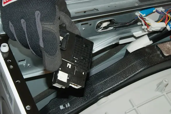 PHOTO: Remove the door lock assembly.