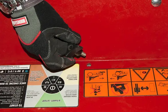 PHOTO: Remove the floorboard screw.