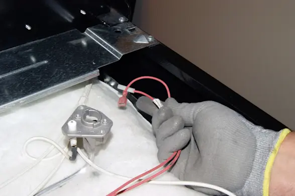 PHOTO: Pull the wire harness for the spark igniters out.