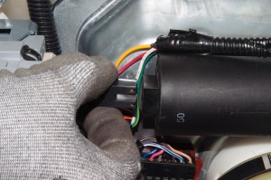 PHOTO: Remove the wire connector from the capacitor.