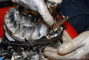Tighten the coil mounting screws.