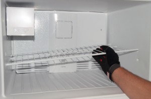 PHOTO: Reinstall the freezer shelf.